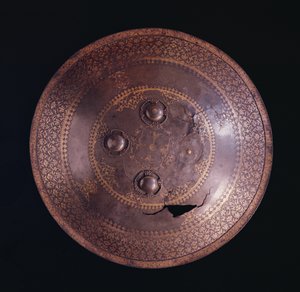 Steel shield with intricate gold decoration